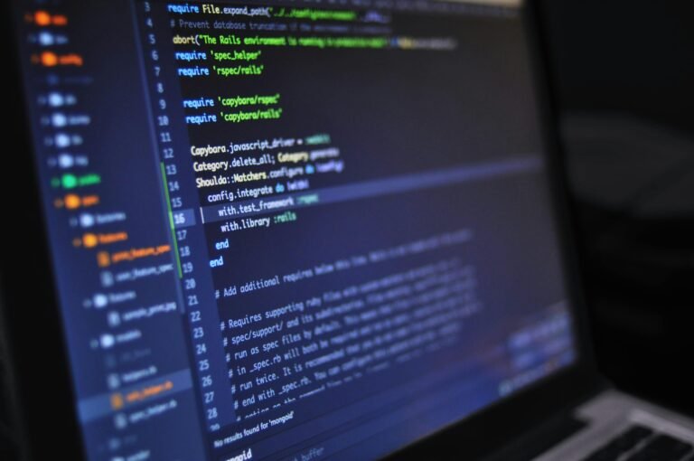 Computer monitor displaying lines of programming code, representing how long does it take to make a video game